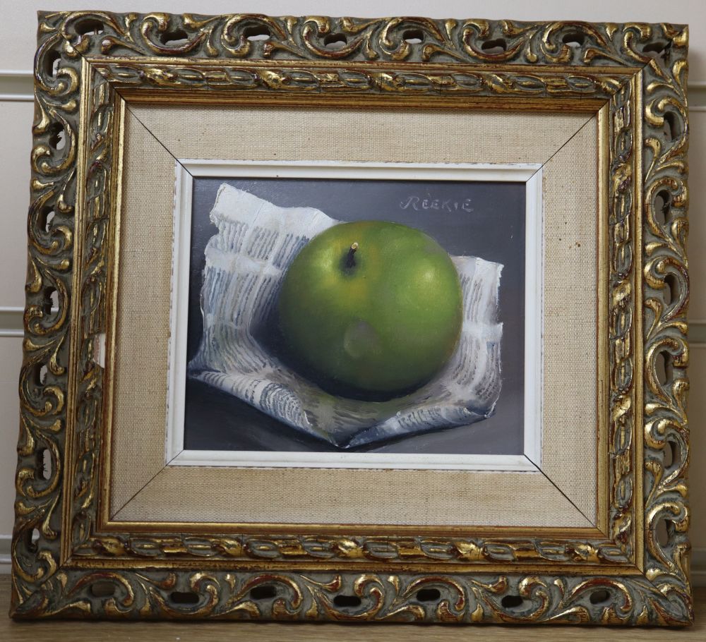 G. Reekie, oil on board, Still life of an apple and newspaper, signed, 11 x 13.5cm